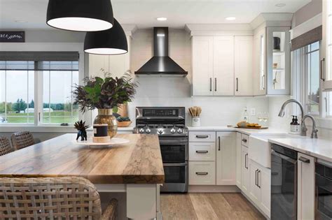 steel appliances black countertop white cabinets and yellow walls kitchen|white appliances for cabinets.